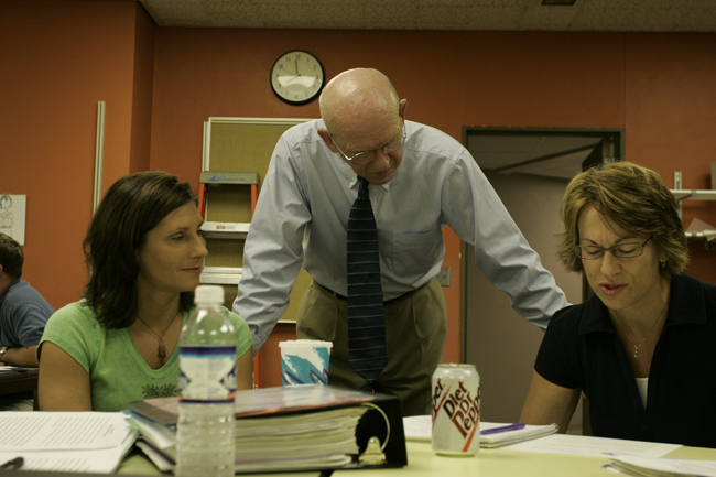 teacher helping students