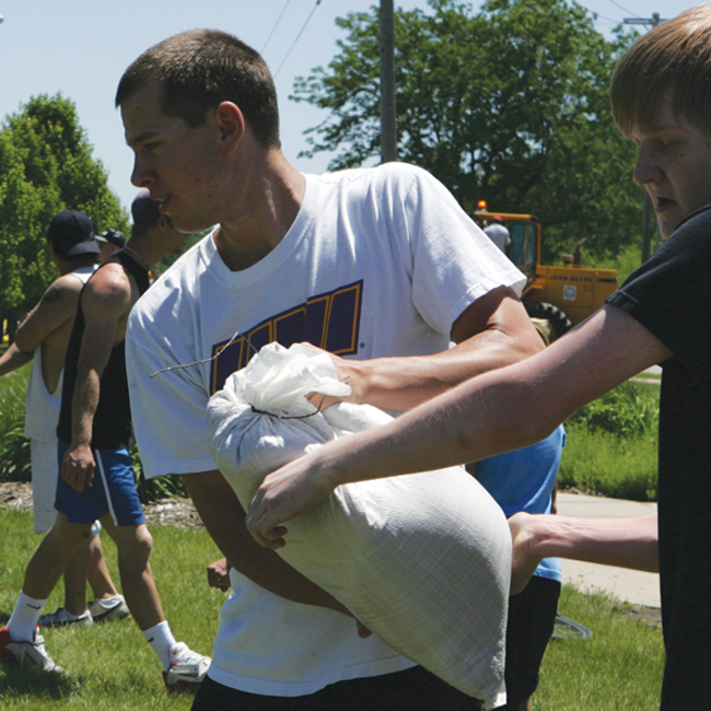 laying sandbags during  flooding